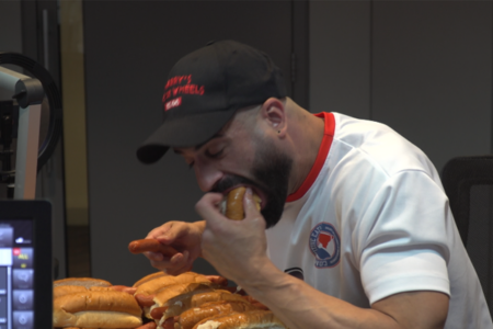 Aussie record hot dog eater competes in the 2GB studio