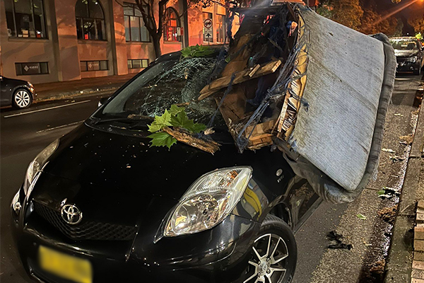 Article image for Where did it come from? Car crushed by couch in Sydney