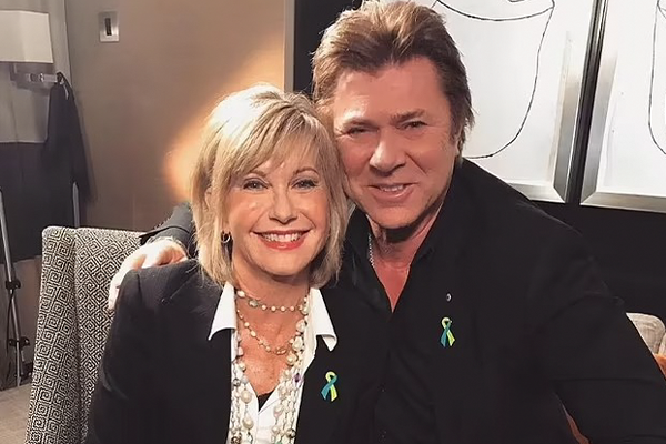 Article image for The time Olivia Newton-John and Richard Wilkins snuck into Coldplay