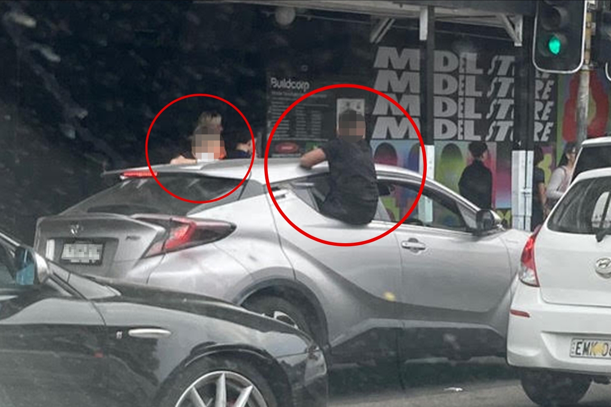 Article image for Bizarre scenes in Sydney CBD: Kids spotted hanging out of rogue car’s windows